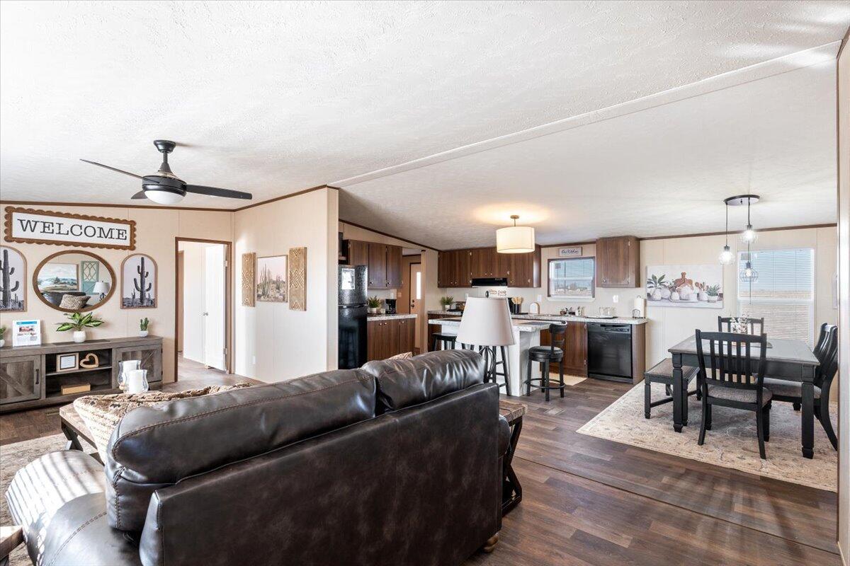 508 Sage Road Tahoka, TX 79373 - Photo 3 of 26 a living room with furniture a fireplace and chairs