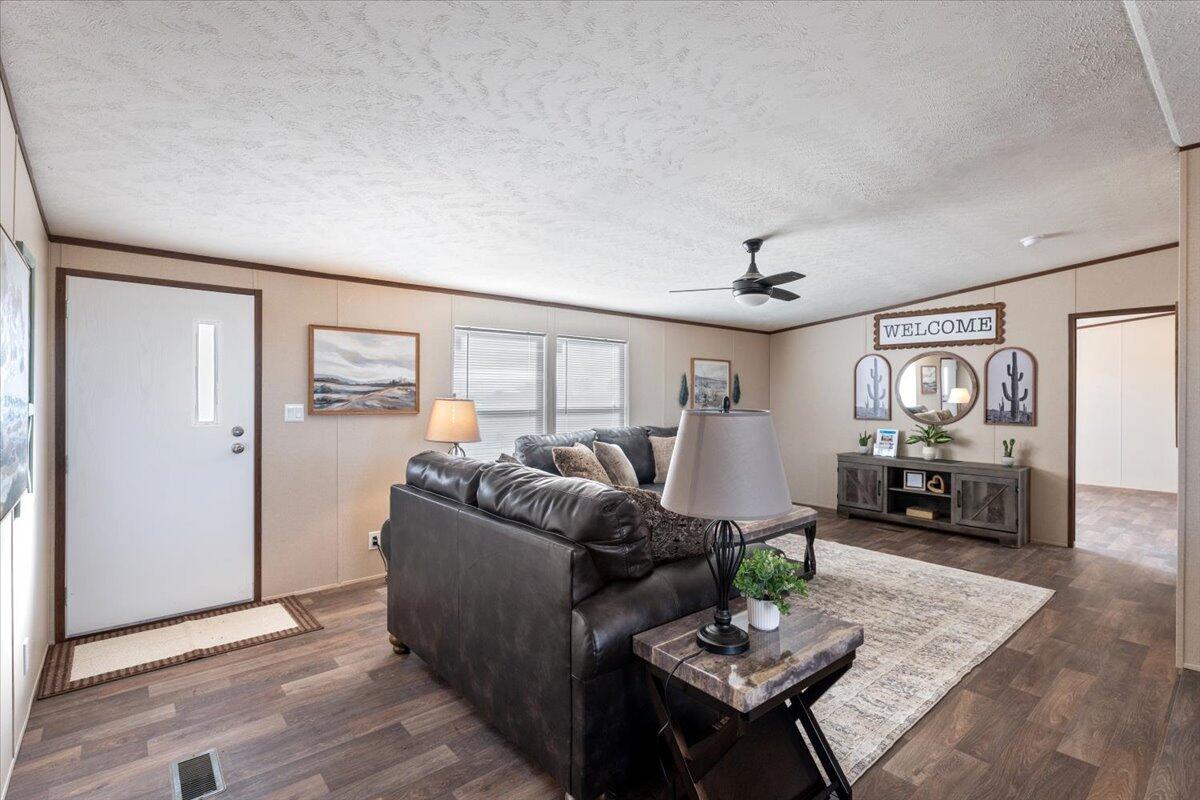 508 Sage Road Tahoka, TX 79373 - Photo 4 of 26 a living room with furniture and wooden floor