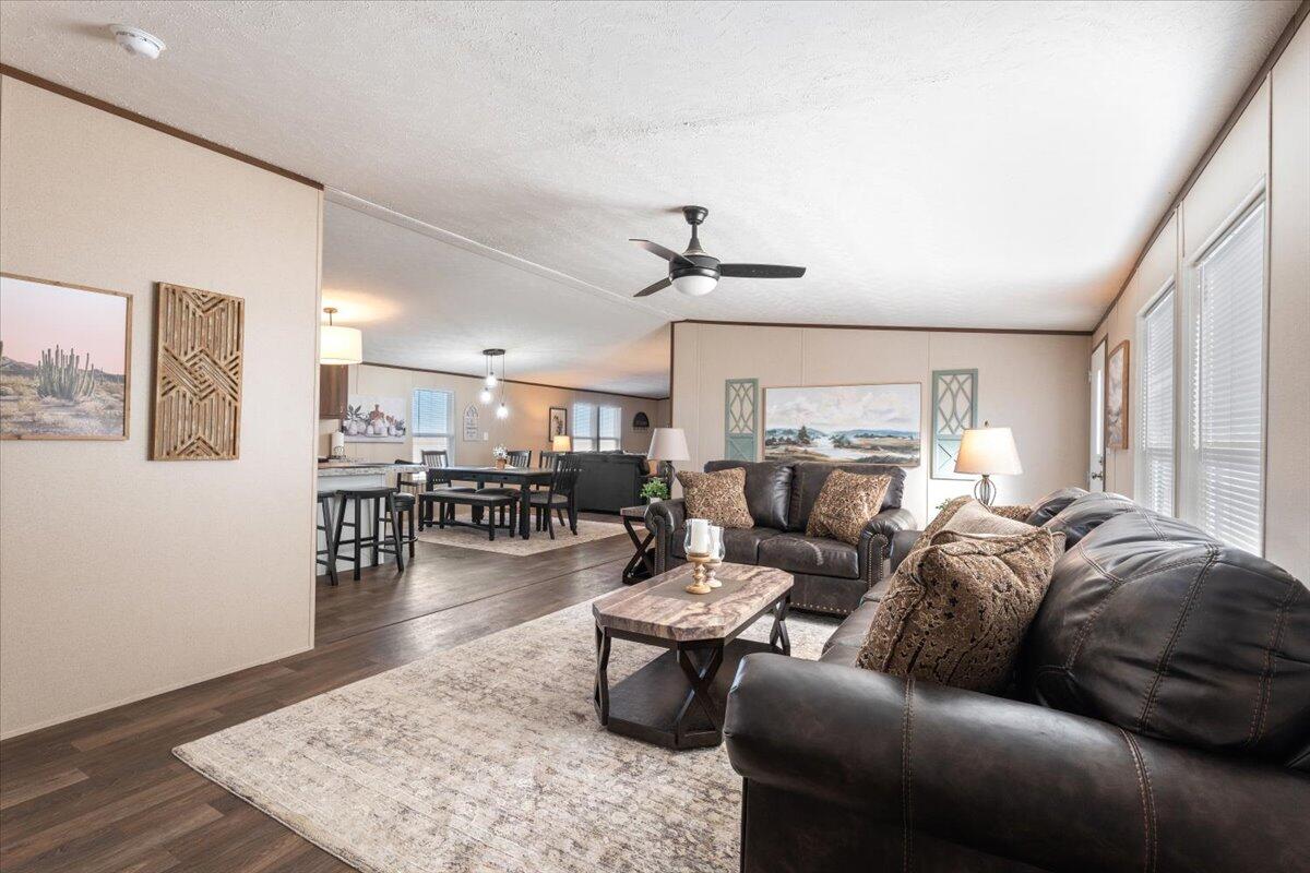 508 Sage Road Tahoka, TX 79373 - Photo 5 of 26 a living room with furniture and a wooden floor