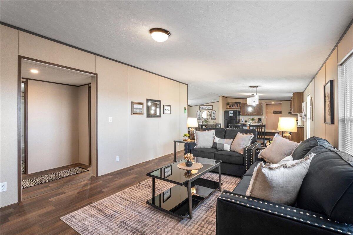 508 Sage Road Tahoka, TX 79373 - Photo 9 of 26 a living room with furniture or couch and a wooden floor