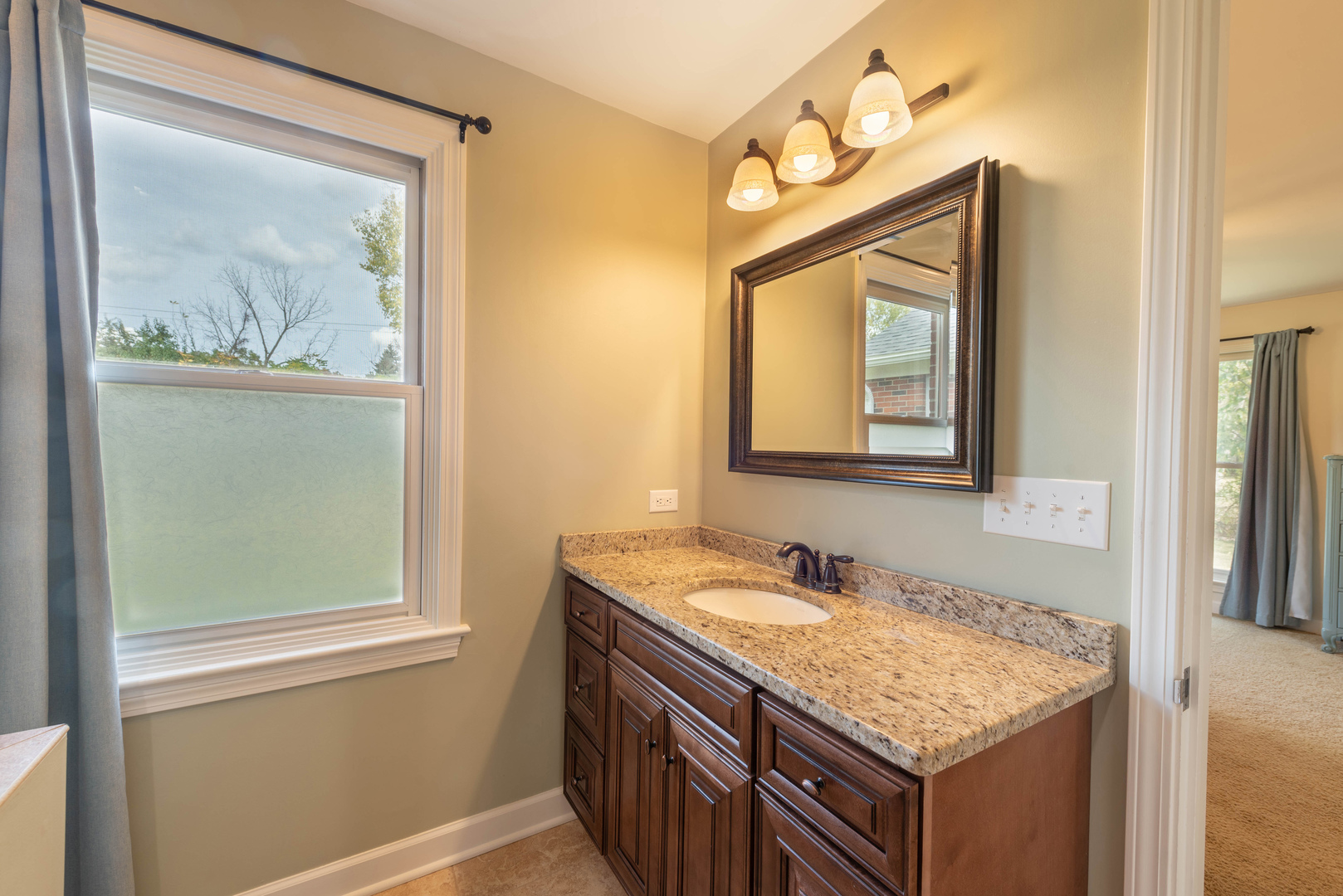 36W231 Crane Road St. Charles, IL 60174 - Photo 14 of 29 a bathroom with a granite countertop sink and a mirror
