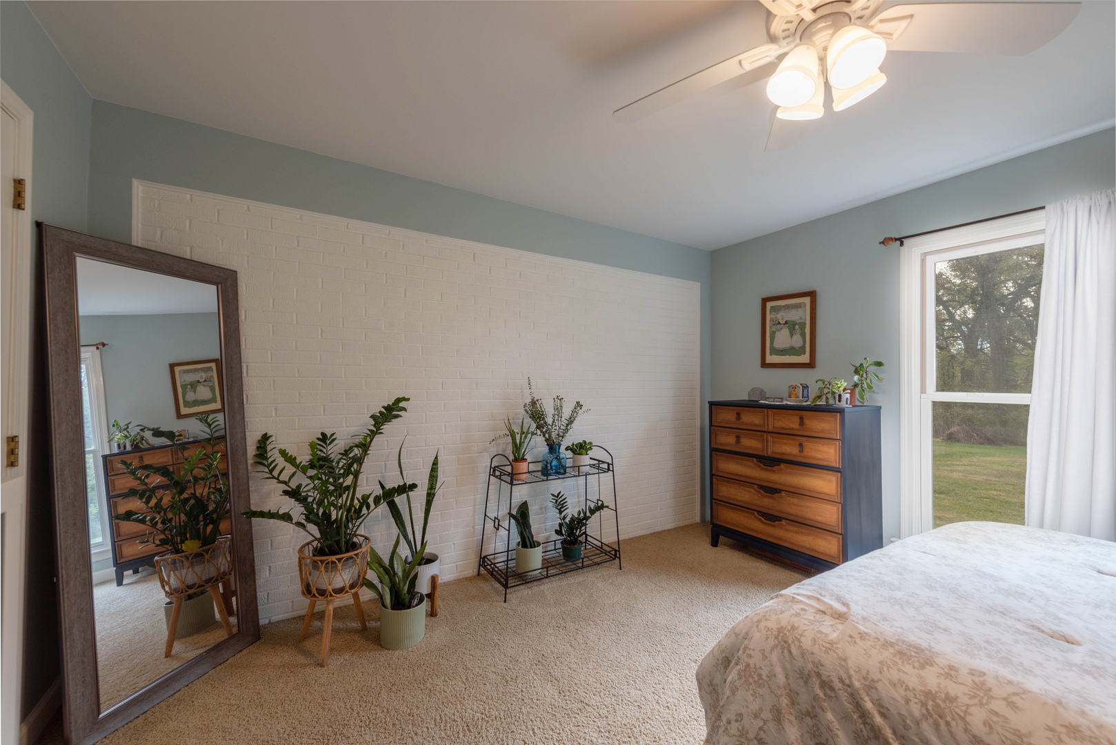 36W231 Crane Road St. Charles, IL 60174 - Photo 16 of 29 a bedroom with a bed and a chandelier