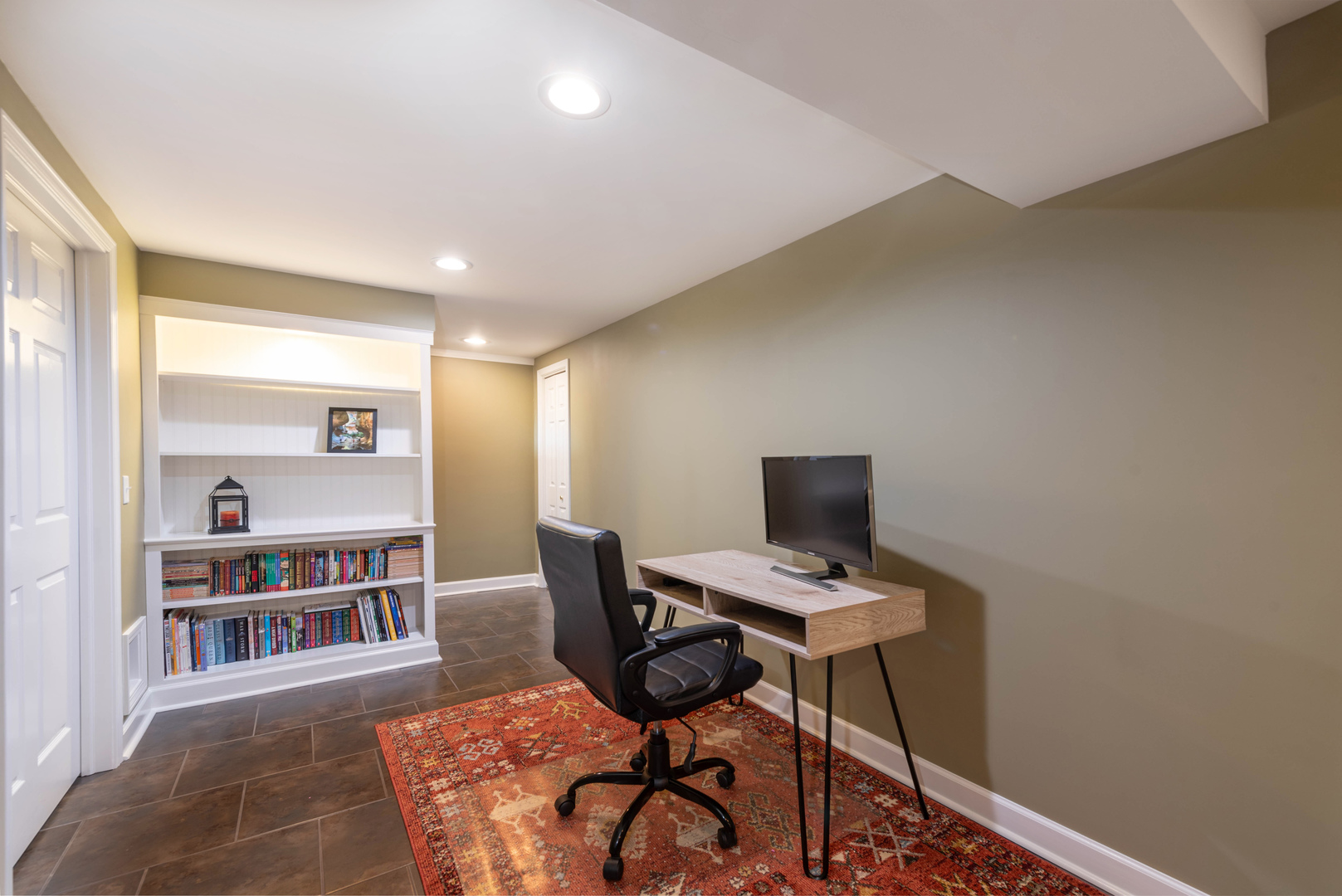 36W231 Crane Road St. Charles, IL 60174 - Photo 23 of 29 a view of a workspace with furniture and a book shelf