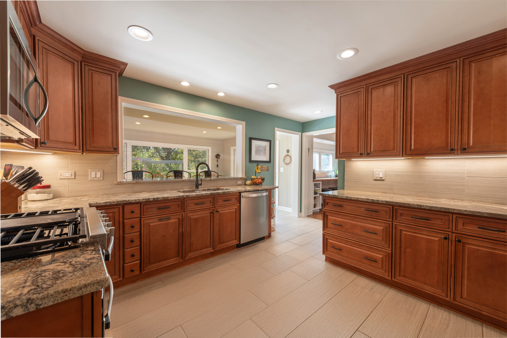 36W231 Crane Road St. Charles, IL 60174 - Photo 3 of 29 a kitchen with stainless steel appliances granite countertop a stove a sink and a microwave