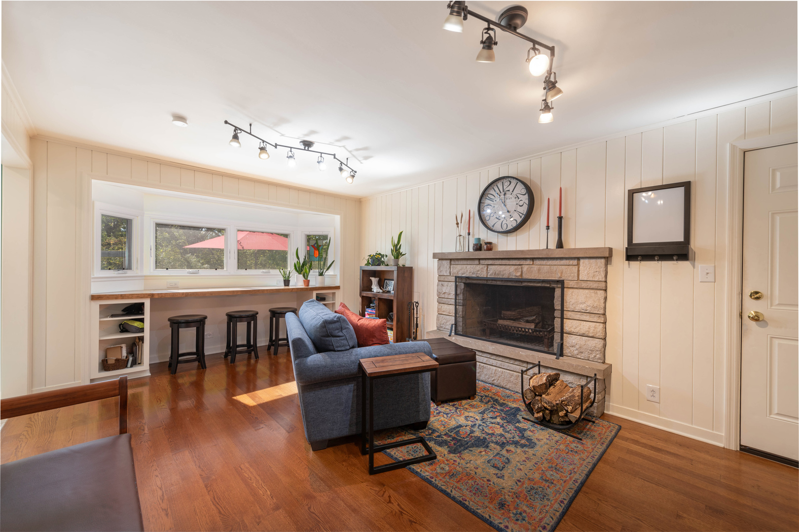 36W231 Crane Road St. Charles, IL 60174 - Photo 10 of 29 a living room with furniture a fireplace and a flat screen tv