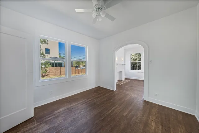 wooden floor in an empty room with a window