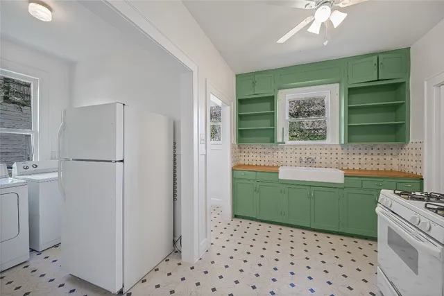 a kitchen with a refrigerator and a sink