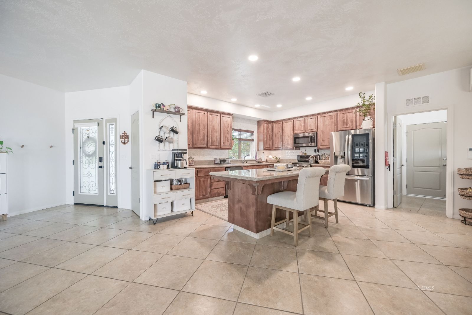 400 Acacia Street Ridgecrest, CA 93555 - Photo 6 of 45 a kitchen with stainless steel appliances a refrigerator sink and cabinets