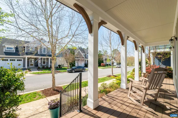 a view of a house with garden and sitting area