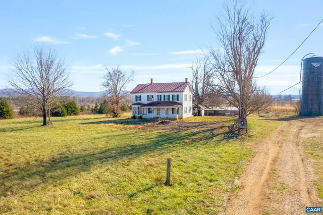 a sign board with yard in front of it
