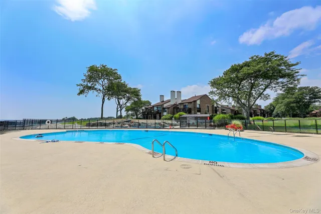 a view of a swimming pool and an outdoor space