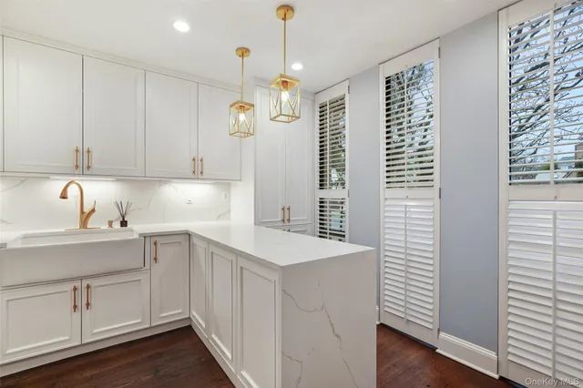 a kitchen that has a lot of cabinets in it