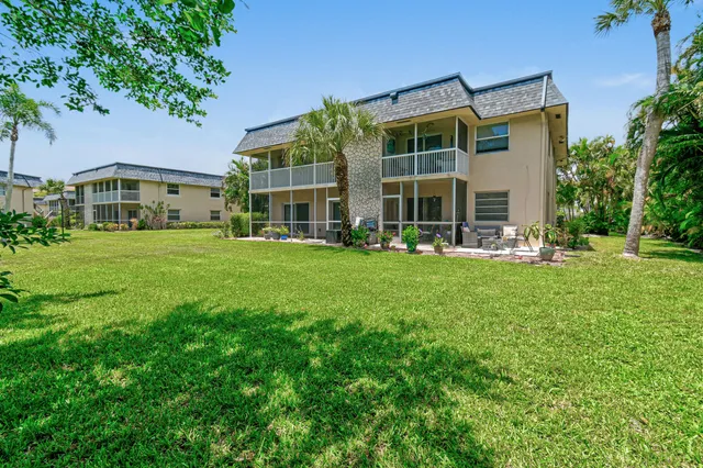 a view of a building with a yard