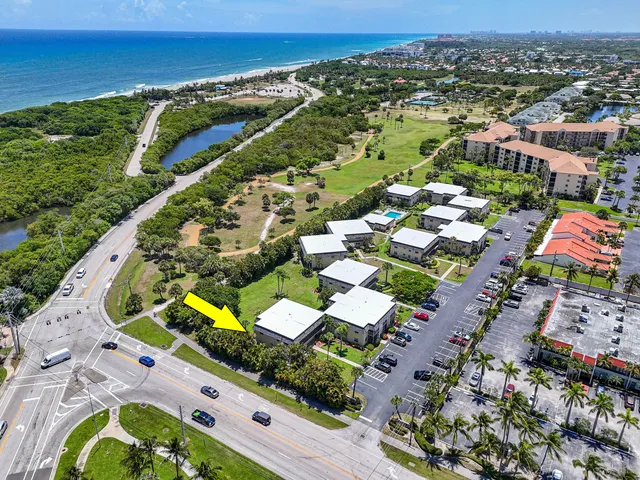 an aerial view of residential houses with outdoor space