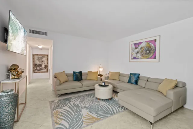 a living room with furniture and a couch