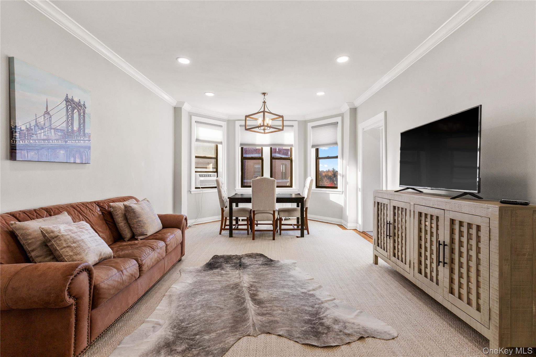 11 Alden Road, Unit 6L Larchmont, NY 10538 - Photo 11 of 22 a living room with furniture and a flat screen tv