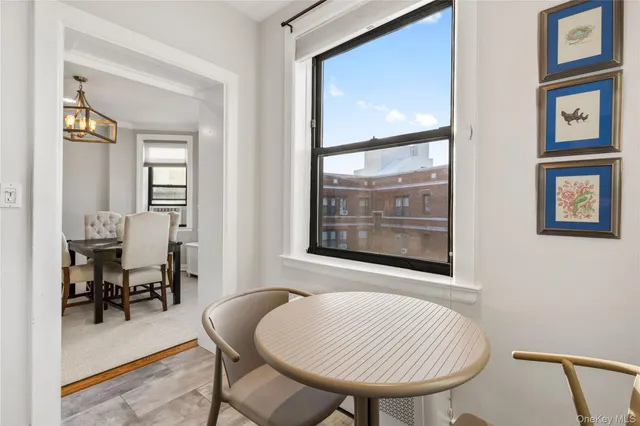 a kitchen with stainless steel appliances kitchen island granite countertop a stove and a microwave