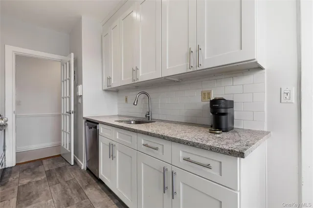 a bedroom with a bed couch and window