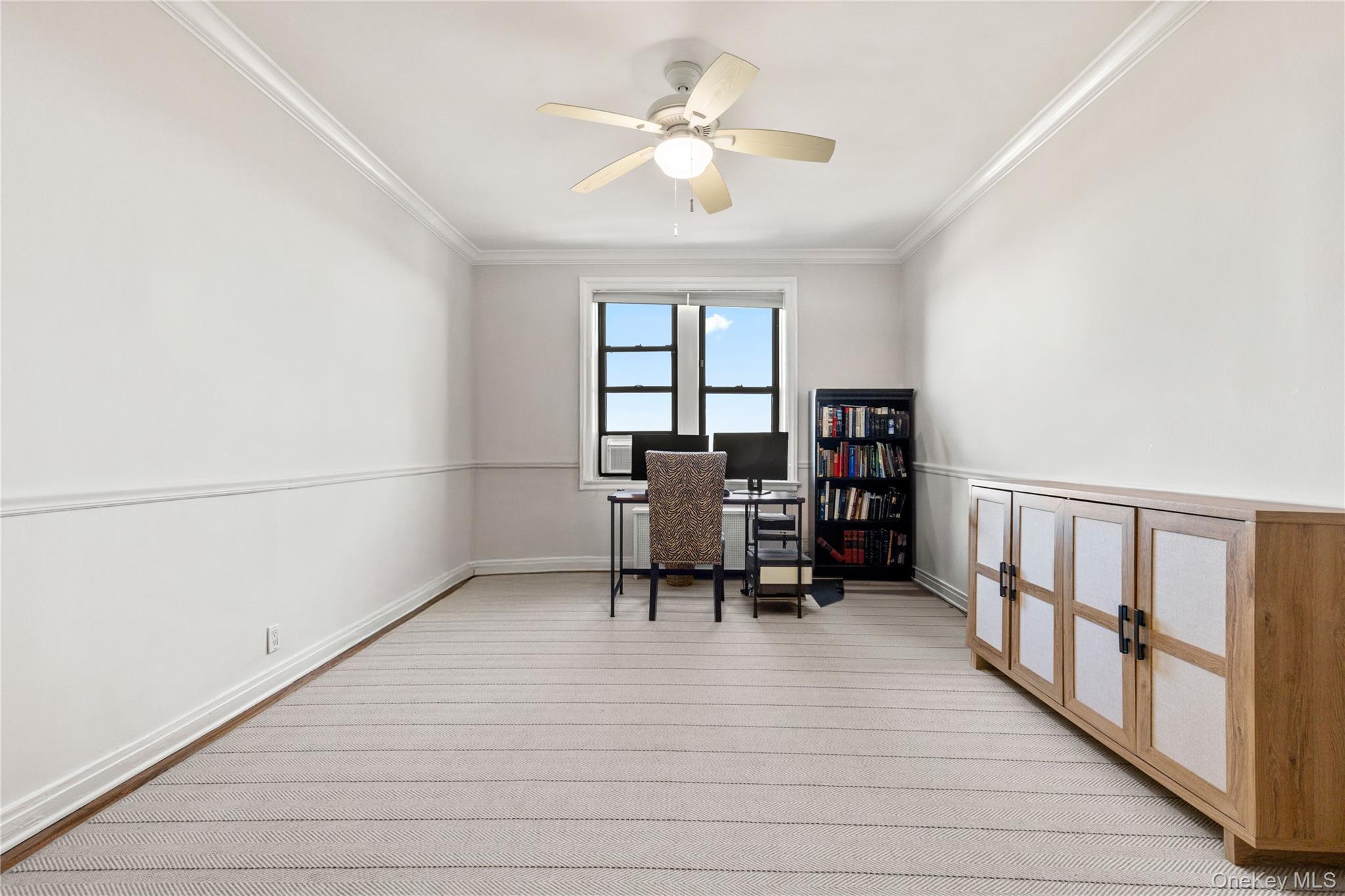 11 Alden Road, Unit 6L Larchmont, NY 10538 - Photo 8 of 22 a workspace with furniture window and a ceiling fan