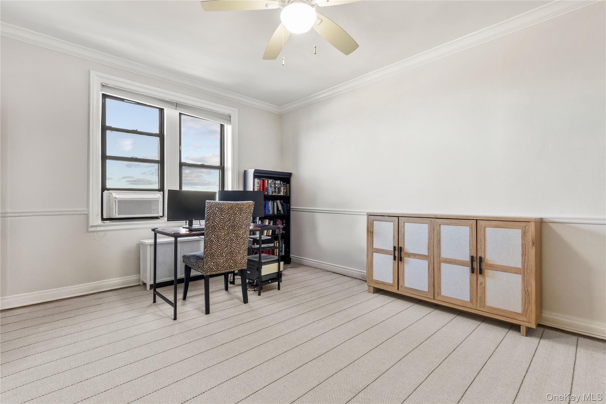 11 Alden Road, Unit 6L Larchmont, NY 10538 - Photo 9 of 22 a workspace with furniture window and wooden floor