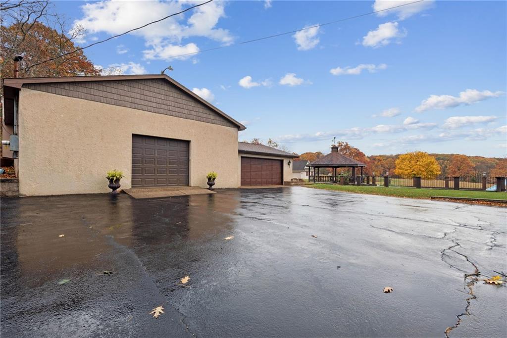 2052 Ridge Road Jeannette, PA 15644 - Photo 28 of 39 a view of a house with backyard and a garage