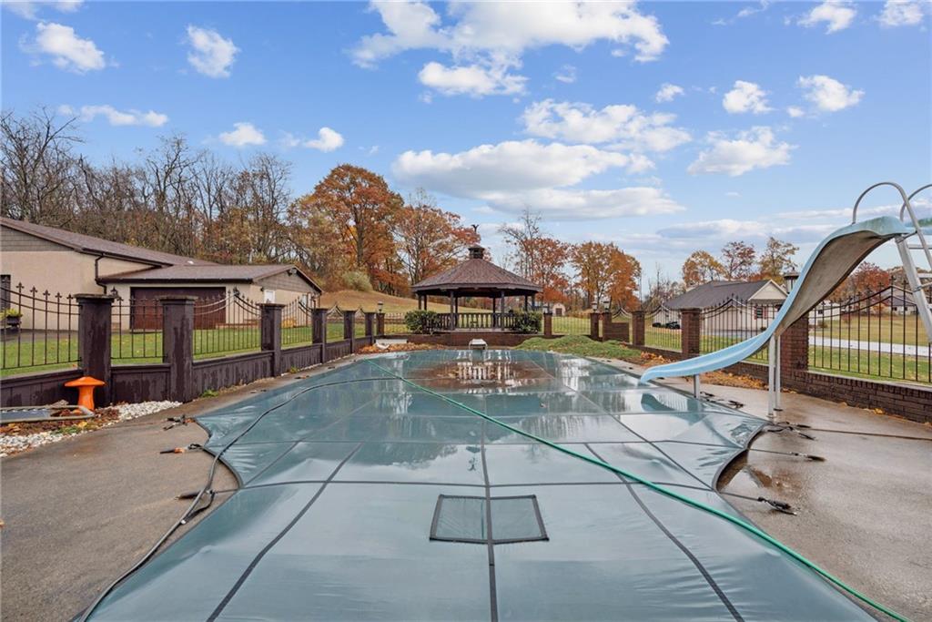 2052 Ridge Road Jeannette, PA 15644 - Photo 34 of 39 a view of a swimming pool with a patio
