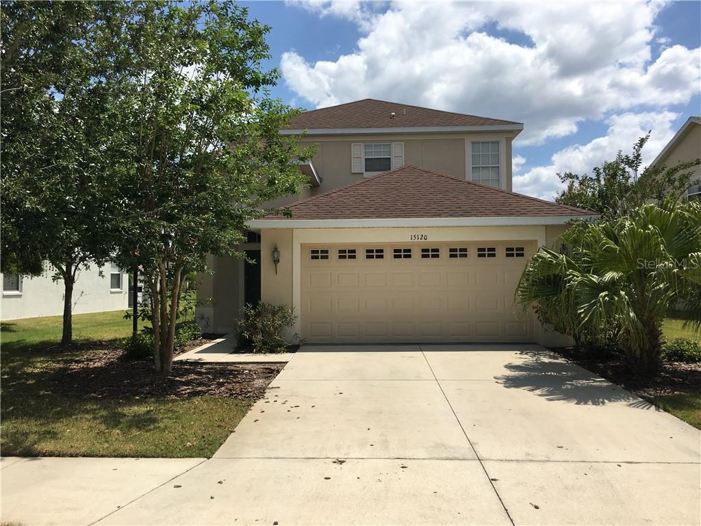15120 Skip Jack Loop Lakewood Ranch, FL 34202 - Photo 1 of 1 a front view of a house with a yard