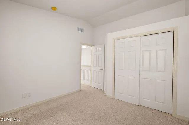 a view of a house with backyard porch and sitting area