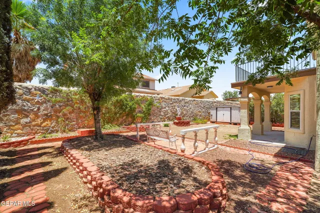 a sign board with yard in the back