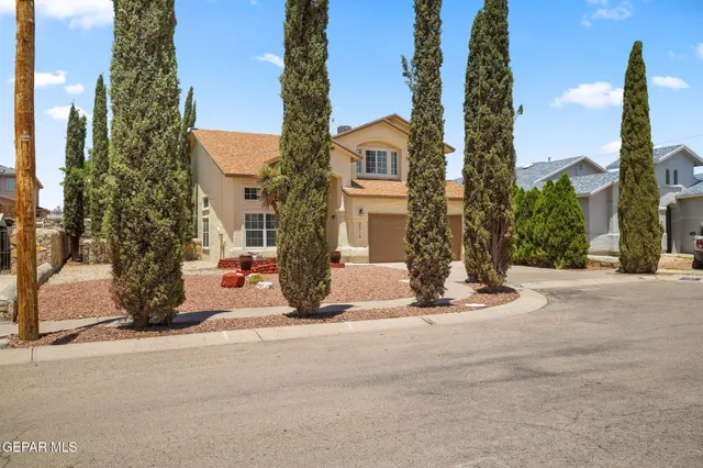 a view of a house with a snow in the background