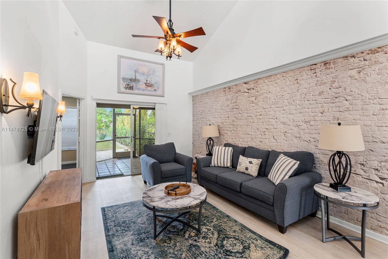 12722 Westhampton Circle Wellington, FL 33414 - Photo 21 of 52 a living room with furniture and a rug