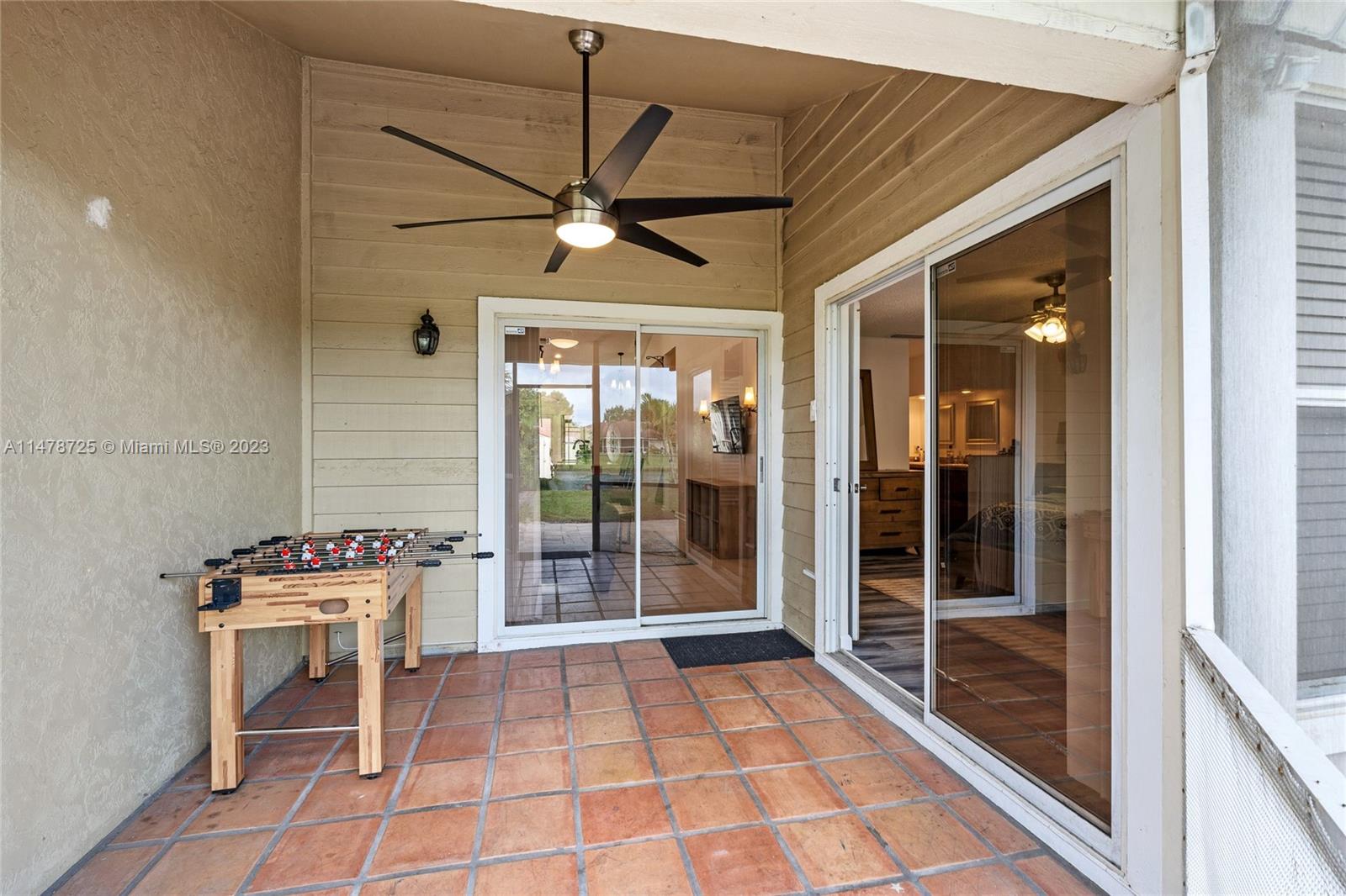 12722 Westhampton Circle Wellington, FL 33414 - Photo 39 of 52 a view of an entryway with a glass door