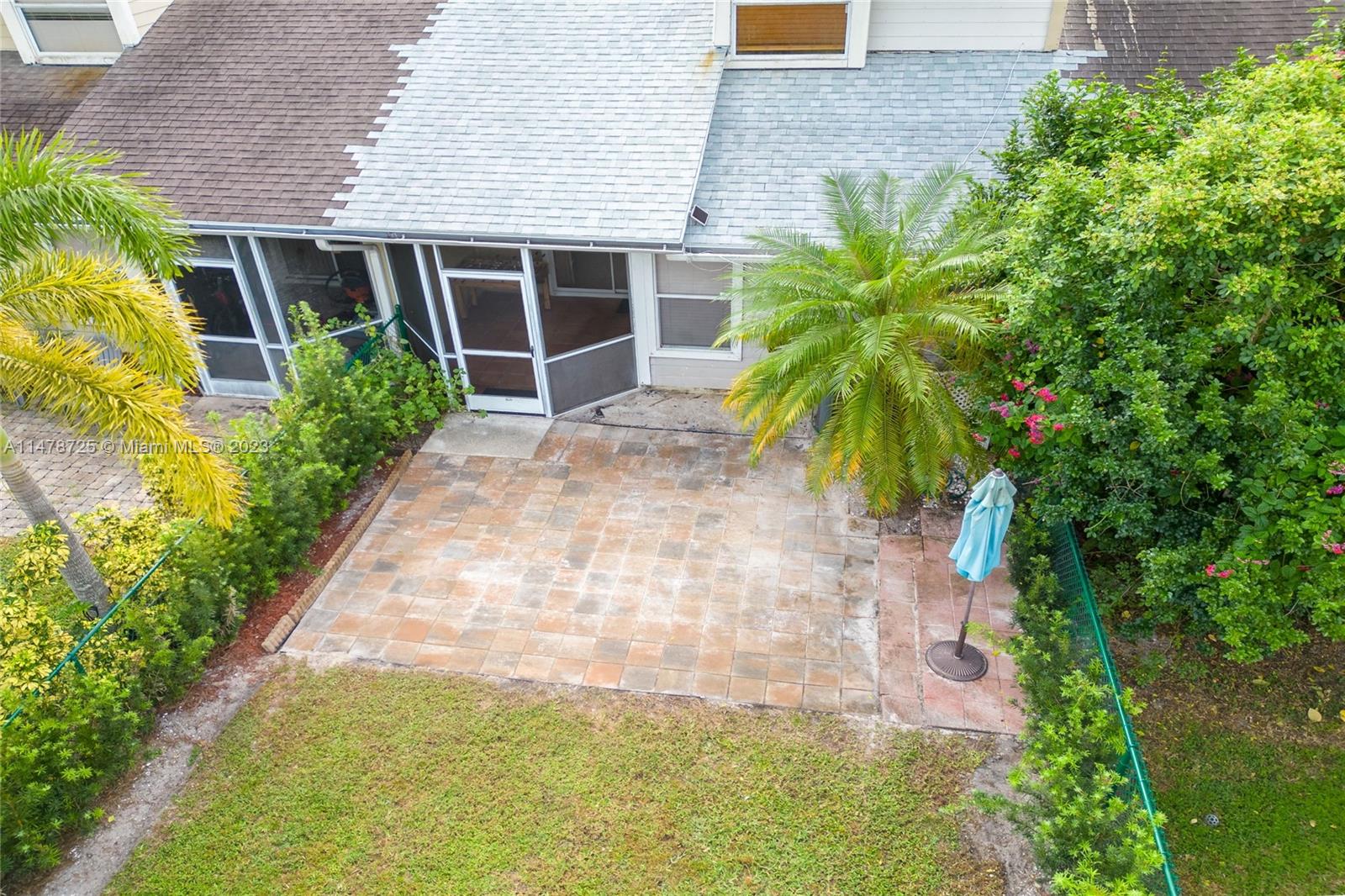 12722 Westhampton Circle Wellington, FL 33414 - Photo 45 of 52 a front view of house with yard and green space