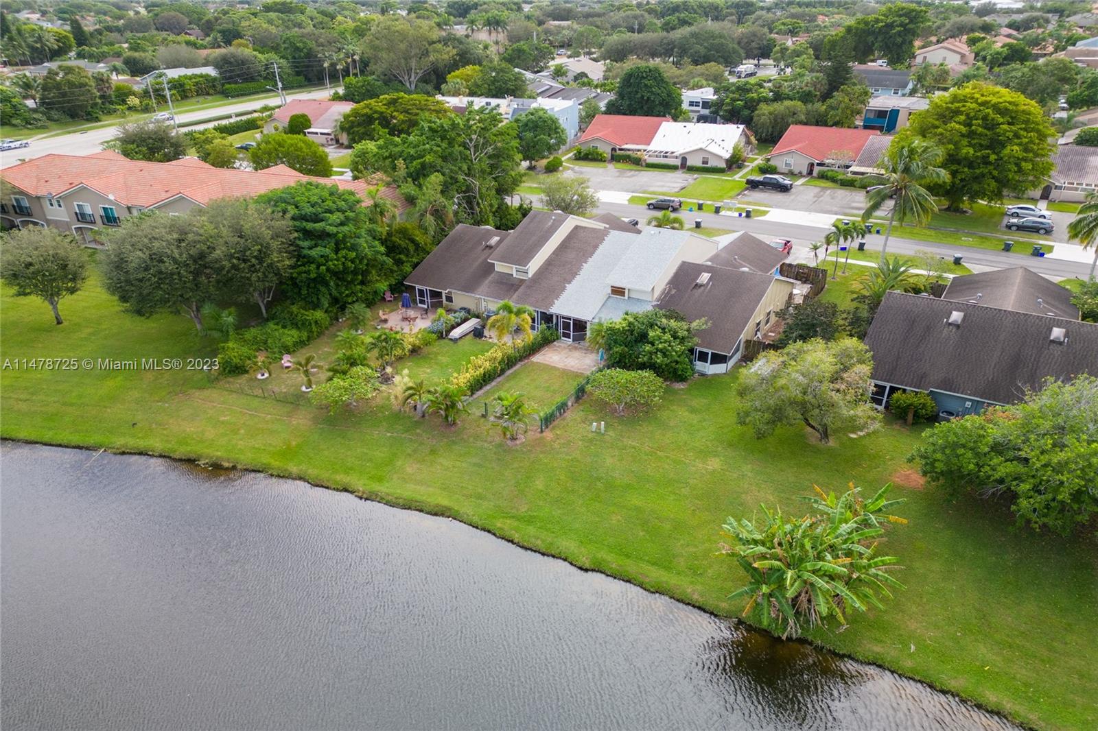 12722 Westhampton Circle Wellington, FL 33414 - Photo 46 of 52 an aerial view of a house with a garden and lake view