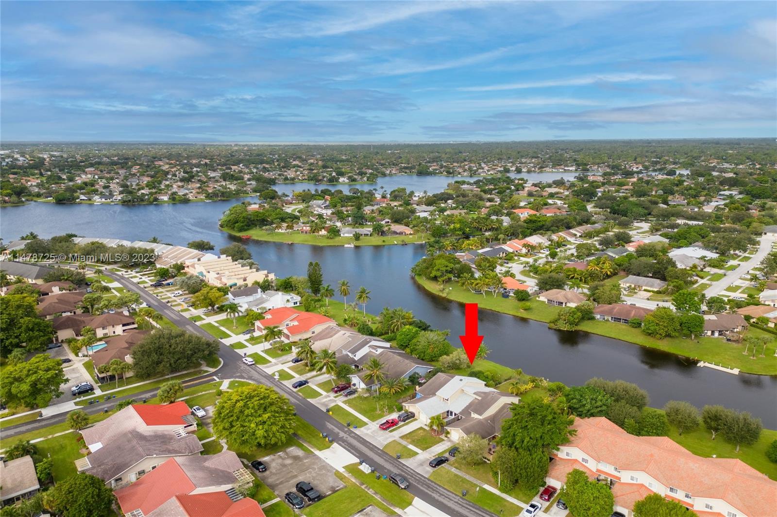 12722 Westhampton Circle Wellington, FL 33414 - Photo 50 of 52 an aerial view of city and lake