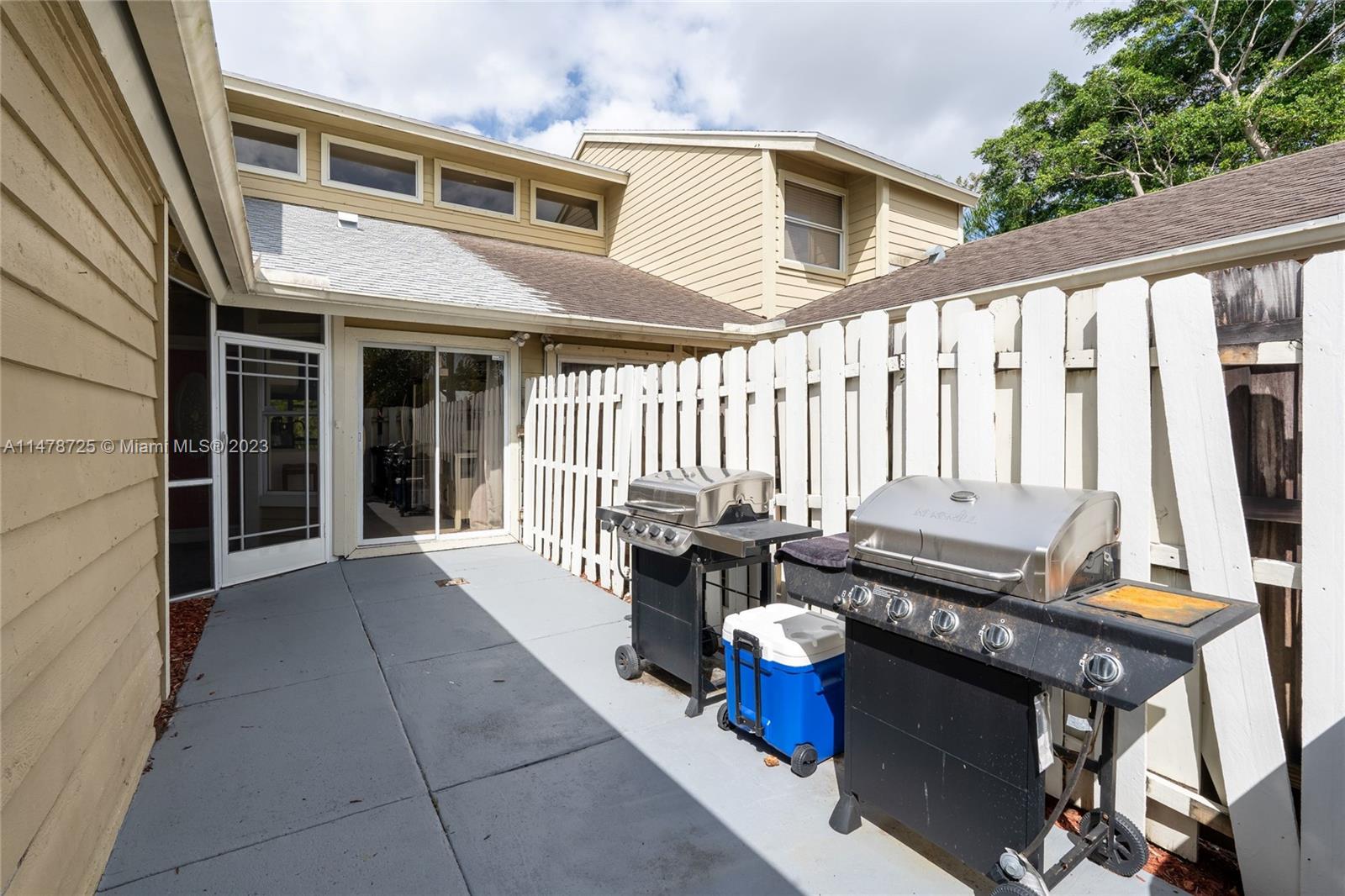 12722 Westhampton Circle Wellington, FL 33414 - Photo 6 of 52 a outdoor view of a house with outdoor seating