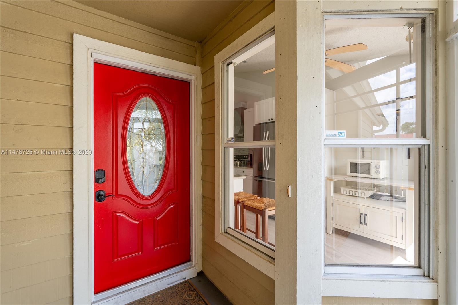 12722 Westhampton Circle Wellington, FL 33414 - Photo 8 of 52 a view of a hallway with washer and dryer
