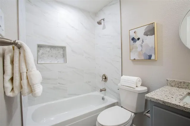 a bathroom with a toilet sink and bathtub