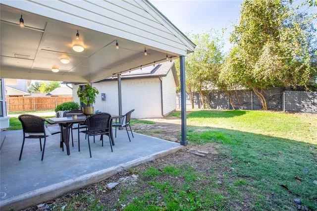 a view of a chairs and table in the patio