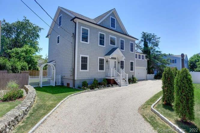 47 Geneva Terrace Fairfield, CT 06824 - Photo 1 of 1 a front view of a house with a yard
