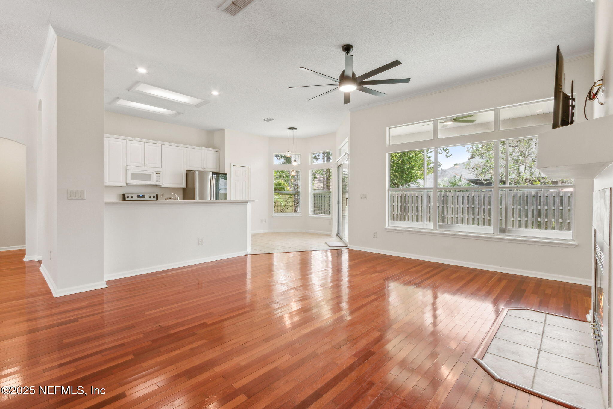 1912 Bluebonnet Way Fleming Island, FL 32003 - Photo 14 of 41 a view of a kitchen with wooden floor and a ceiling fan