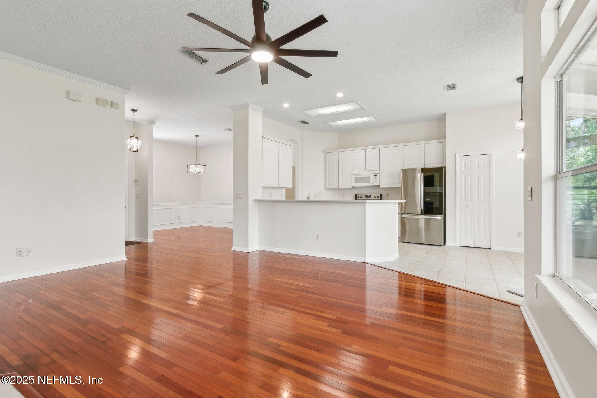 1912 Bluebonnet Way Fleming Island, FL 32003 - Photo 15 of 41 a view of a kitchen with wooden floor and a window