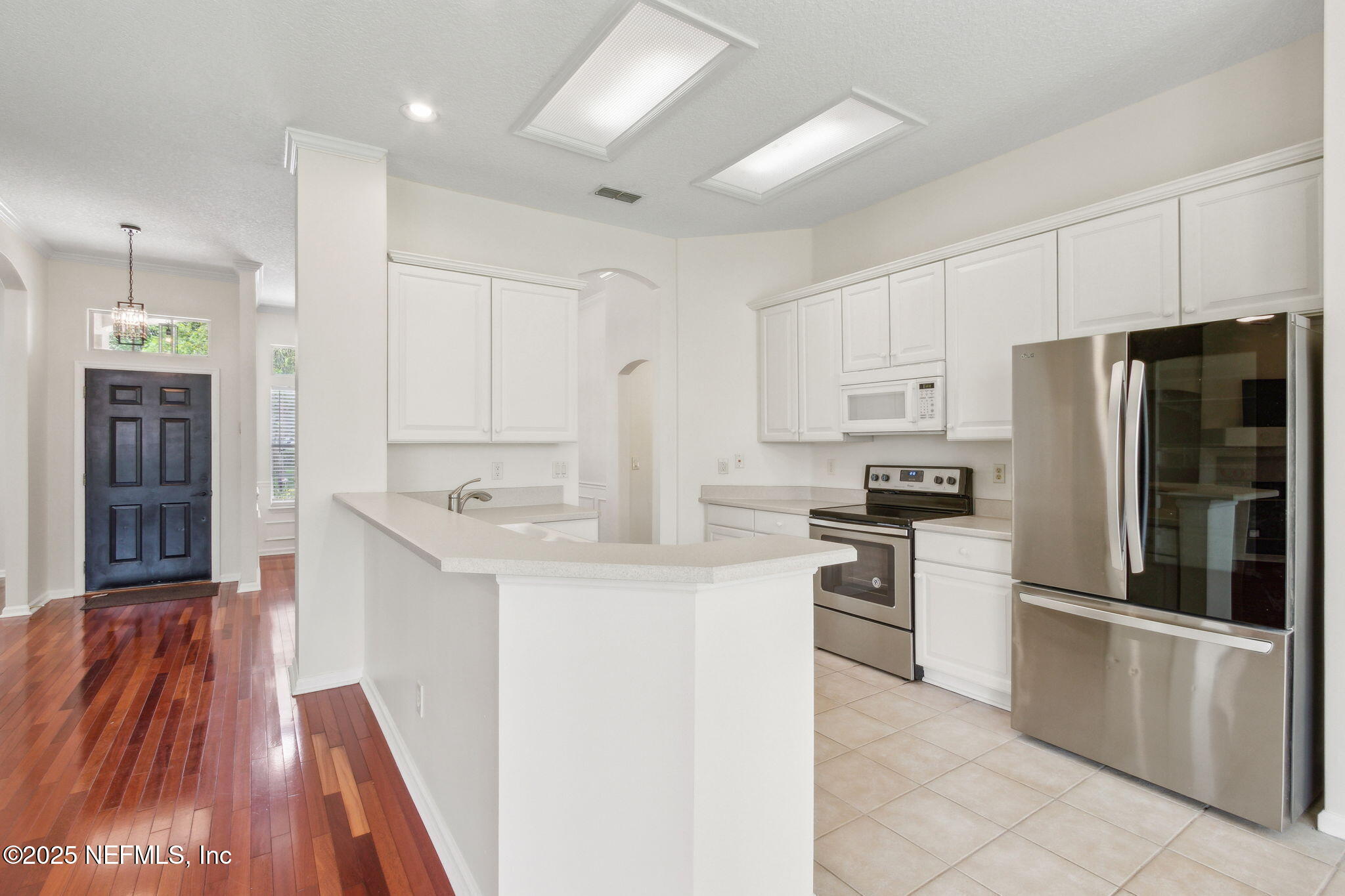 1912 Bluebonnet Way Fleming Island, FL 32003 - Photo 16 of 41 a kitchen with stainless steel appliances granite countertop a refrigerator sink and stove