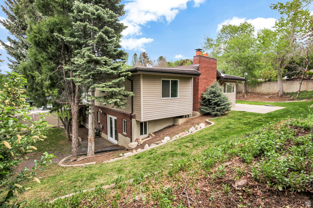 1320 Canyon Park Road Bountiful, UT 84010 - Photo 26 of 28 Rear view of house featuring a chimney