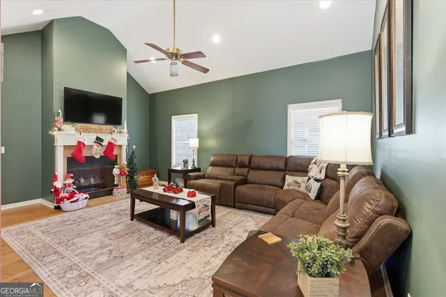 a living room with furniture and a flat screen tv
