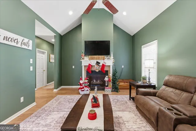 a living room with furniture and a air conditioner vent