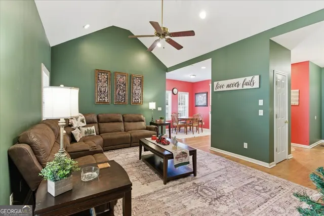 a bedroom with a bed lamps and a fireplace