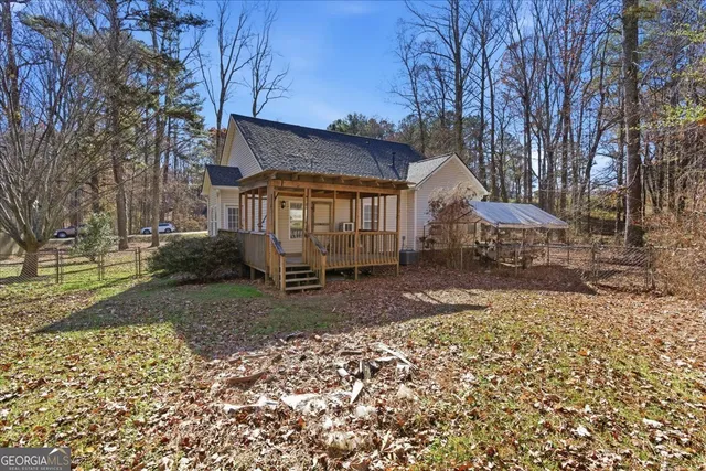 a view of a yard with large trees