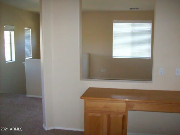 a view of a room that has a window in it