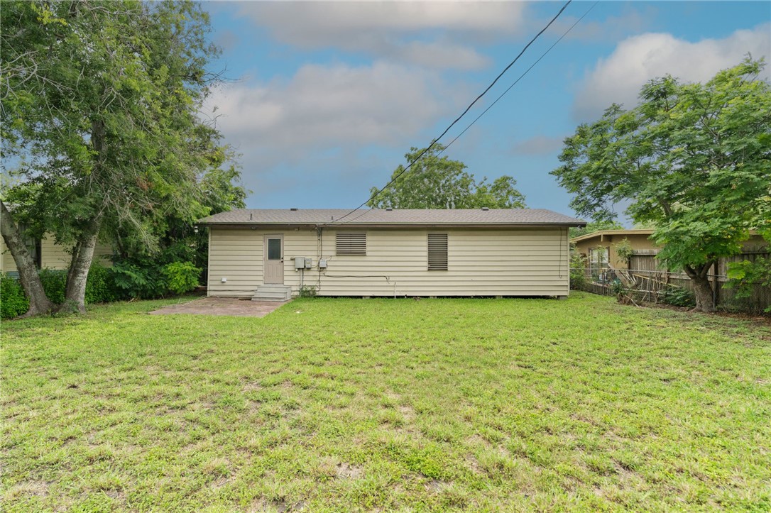 5921 Riley Drive Corpus Christi, TX 78412 - Photo 19 of 20 a front view of a house with a garden